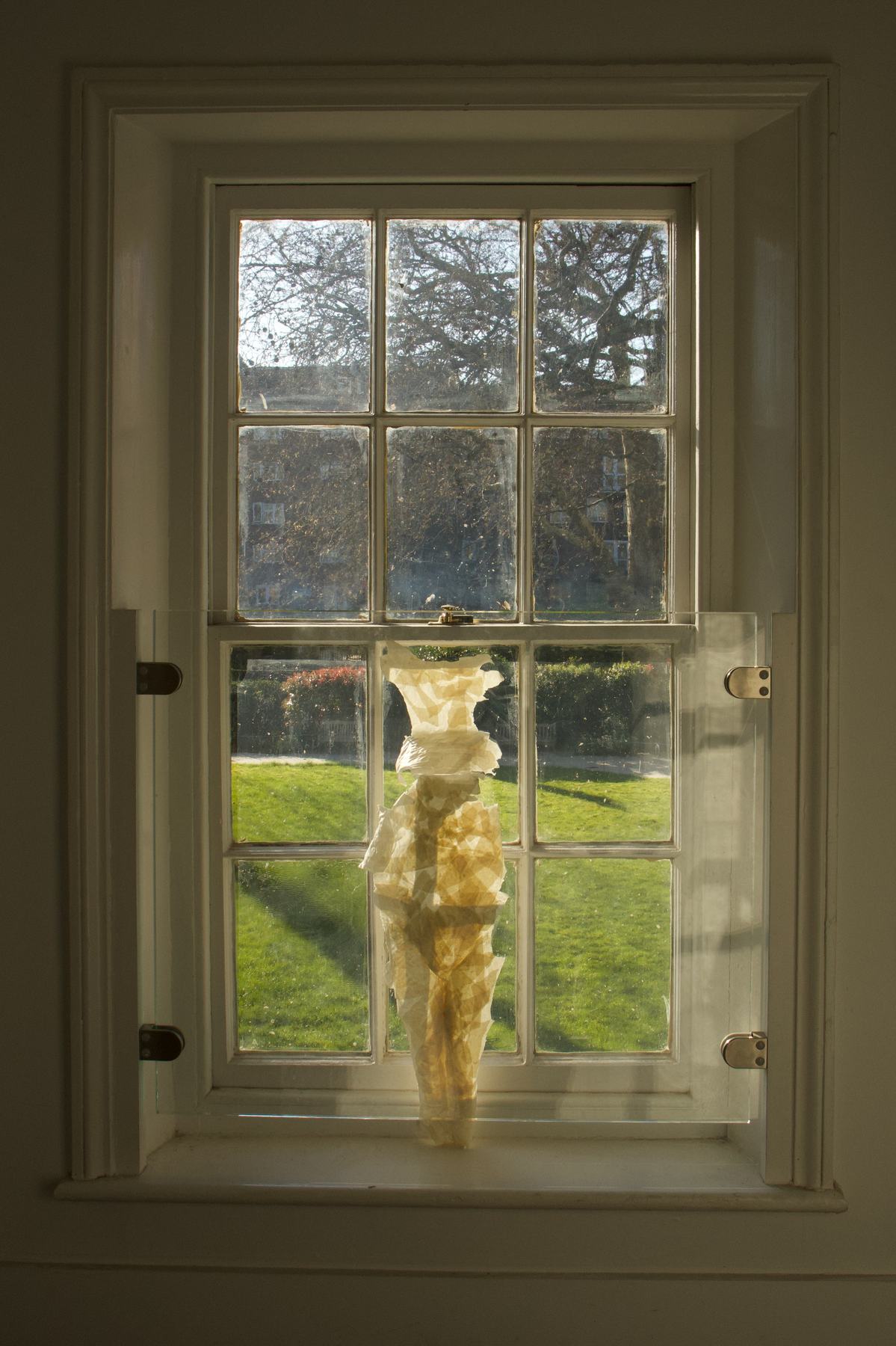 A Xuan paper body cast installed in a window.